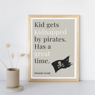 Humorous Treasure Island print in wooden frame, leaning against a plain wall. Small beige decoration nearby. From Bookish Prints collection by StrangeBooks UK