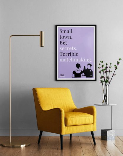 Humorous Emma print in black frame on wall, with a yellow armchair in front next to a tall angular lamp and plant on a table. From Bookish Prints collection by StrangeBooks UK