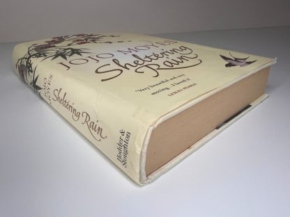 Affordable secondhand Sheltering Rain by Jojo Moyes, hardback, good condition, photo-verified, StrangeBooks UK