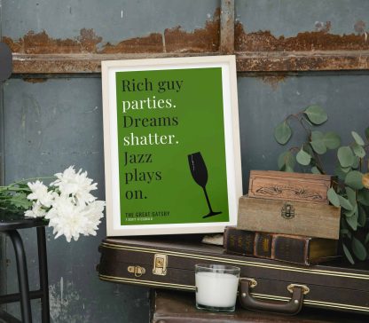 Humorous The Great Gatsby print in white wooden frame, perched on a violin case next to some books. From Bookish Prints collection by StrangeBooks UK