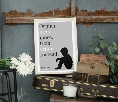 Humorous Oliver Twist print in white wooden frame, perched on a violin case next to some books. From Bookish Prints collection by StrangeBooks UK