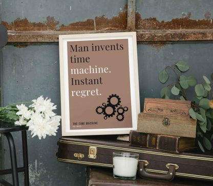 Humorous The Time Machine print in white wooden frame, perched on a violin case next to some books. From Bookish Prints collection by StrangeBooks UK