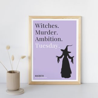 Humorous Macbeth print in wooden frame, leaning against a plain wall. Small beige decoration nearby. From Bookish Prints collection by StrangeBooks UK