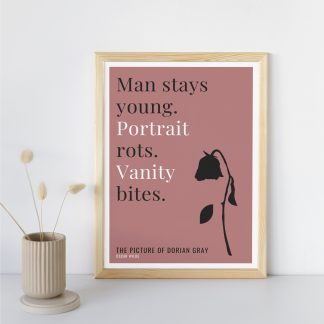 Humorous Picture of Dorian Gray print in wooden frame, leaning against a plain wall. Small beige decoration nearby. From Bookish Prints collection by StrangeBooks UK