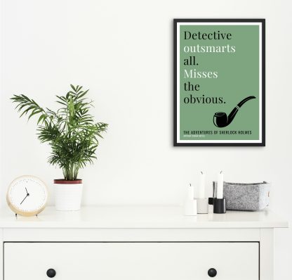 Humorous Adventures of Sherlock Holmes print in black frame on wall, with white chest of drawers and plants and candles below. From Bookish Prints collection by StrangeBooks UK