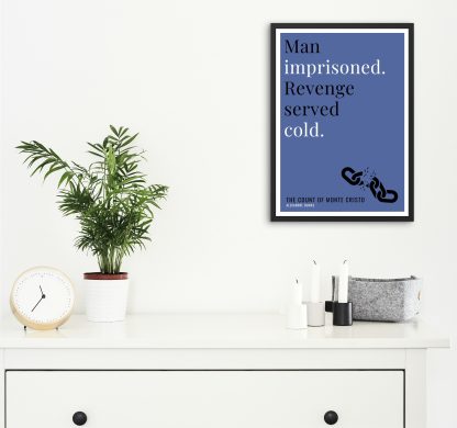 Humorous The Count of Monte Cristo print in black frame on wall, with white chest of drawers and plants and candles below. From Bookish Prints collection by StrangeBooks UK
