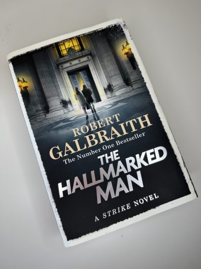 An image of the book The Hallmarked Man by Robert Galbraith