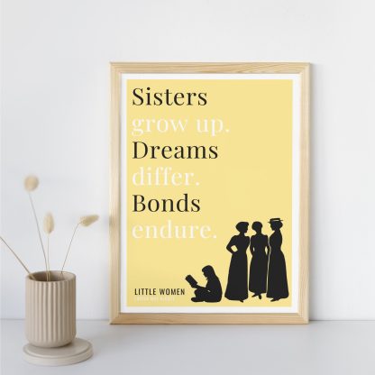 Humorous Little Women print in wooden frame, leaning against a plain wall. Small beige decoration nearby. From Bookish Prints collection by StrangeBooks UK