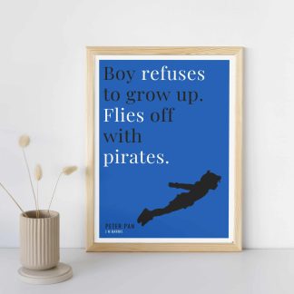 Humorous Peter Pan print in wooden frame, leaning against a plain wall. Small beige decoration nearby. From Bookish Prints collection by StrangeBooks UK
